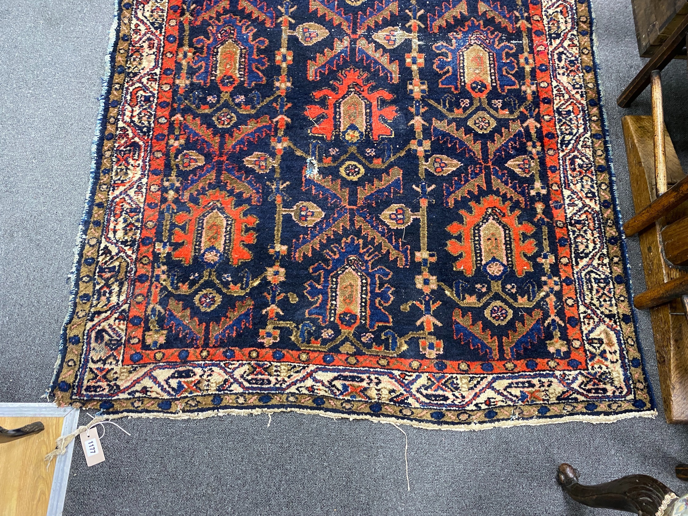 An antique Caucasian blue ground rug, 194 x 132cm